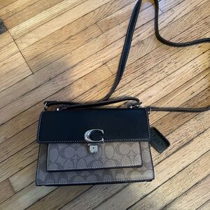 New cute coach cross body bag..never used ..brand new no tags.